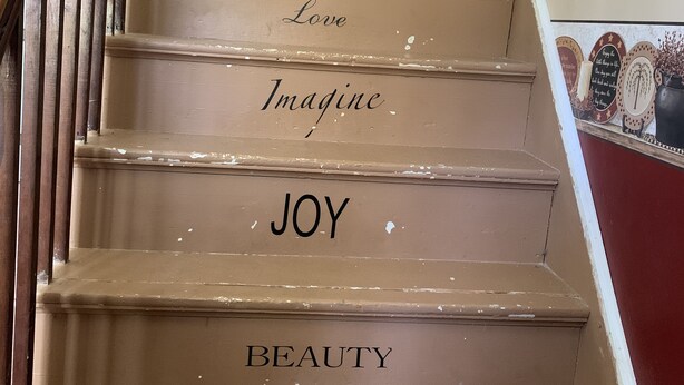 A staircase with motivational words on each step.