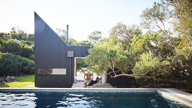 A modern house with a swimming pool, outdoor seating, and a view of the surrounding greenery. - THE BACH - ST ANDREWS BEACH (St Andrews Beach)