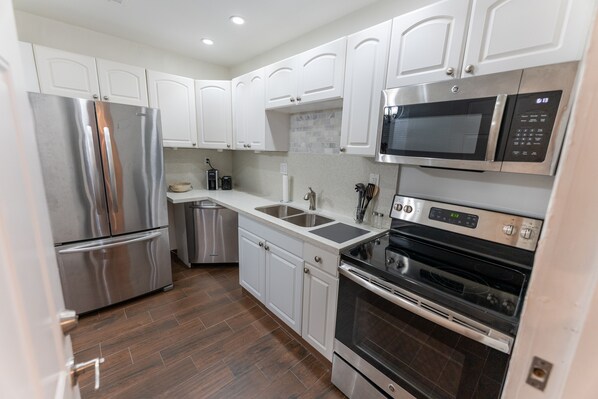 Fridge, microwave, dishwasher, coffee/tea maker