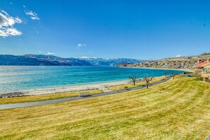 Enjoy a peaceful lakeside retreat with serene views of the water and distant mountains.