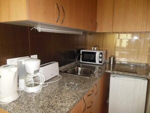Fridge, microwave, coffee/tea maker, toaster