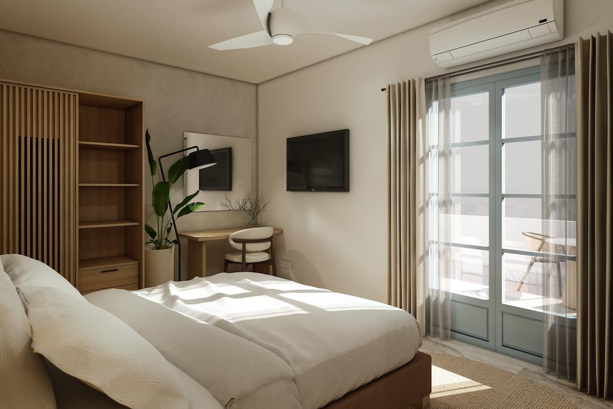 A bedroom with a bed, a desk, a chair, a potted plant, and a large window with curtains.