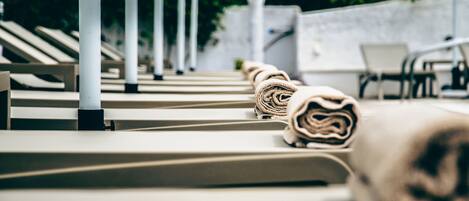 Seasonal outdoor pool, pool umbrellas, pool loungers