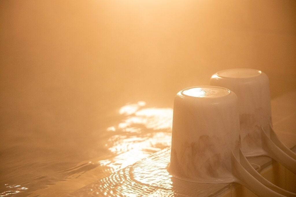 Two white cylindrical objects with a reflective surface, possibly part of a spa or wellness facility.