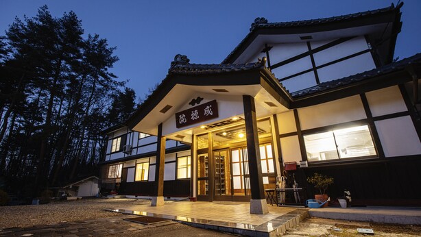 A traditional Japanese building with a wooden entrance and a sign above the door. - kongoji syukubo seihoin (Azumino)