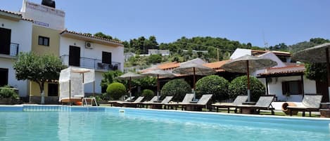 Seasonal outdoor pool, open 9:00 AM to 7:00 PM, pool umbrellas