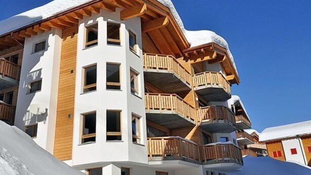 A multi-story hotel with wooden balconies and a snow-covered roof. - Mon Reve Bergh (Bettmeralp)