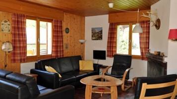 Chalet, 4 Bedrooms | Living room | TV, fireplace