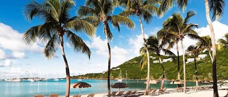 On the beach, sun loungers, beach towels
