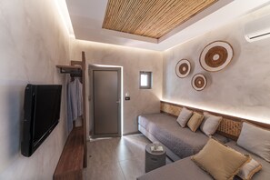Junior Suite, Balcony | Living area | 32-inch flat-screen TV with satellite channels, TV - Oasis Hotel Prasonisi (Rhodes)