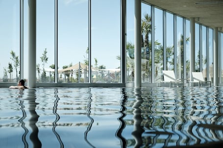 2 indoor pools, seasonal outdoor pool, sun loungers, lifeguards on site