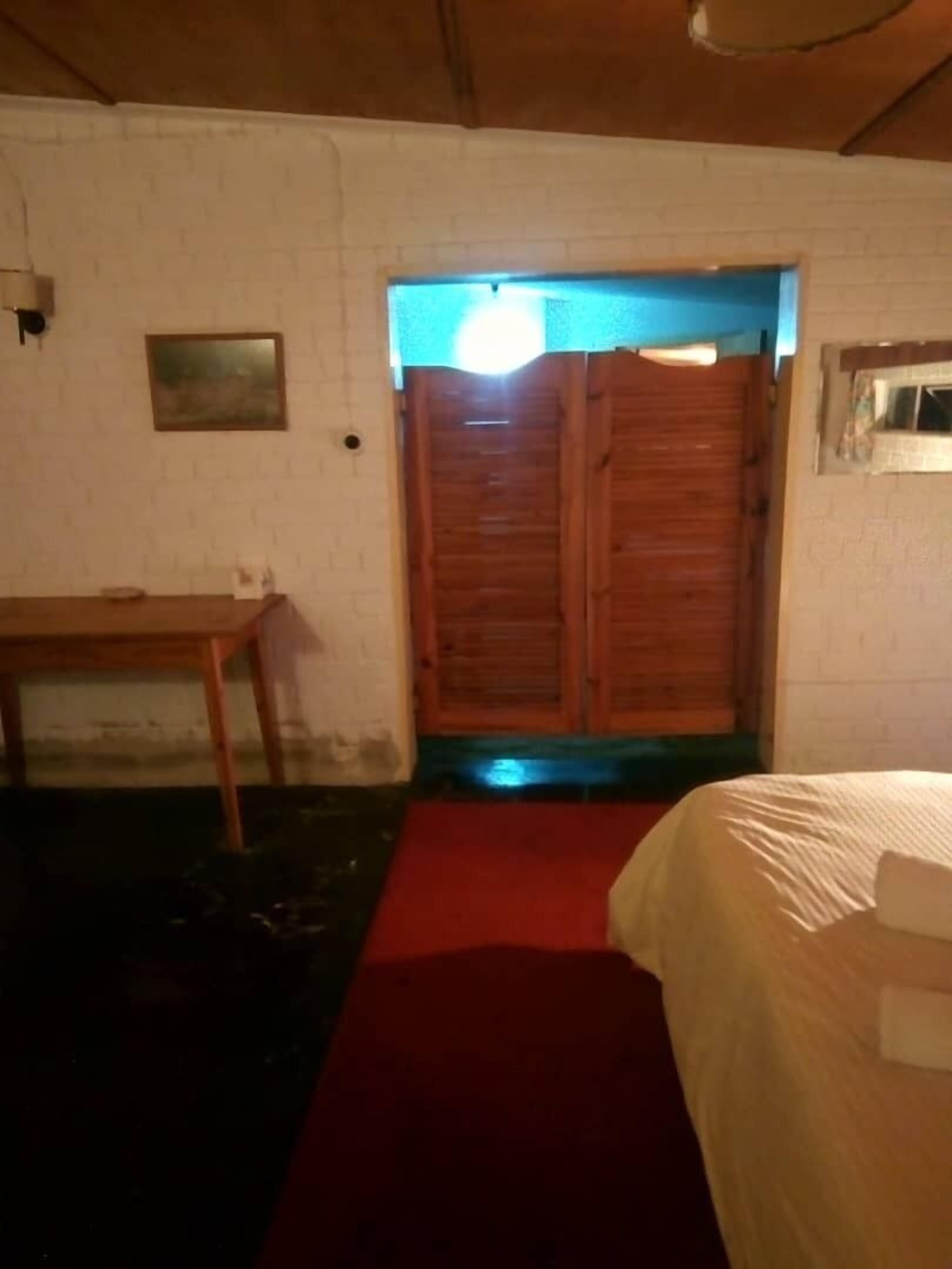 Family Room | Premium bedding, down comforters, desk, laptop workspace