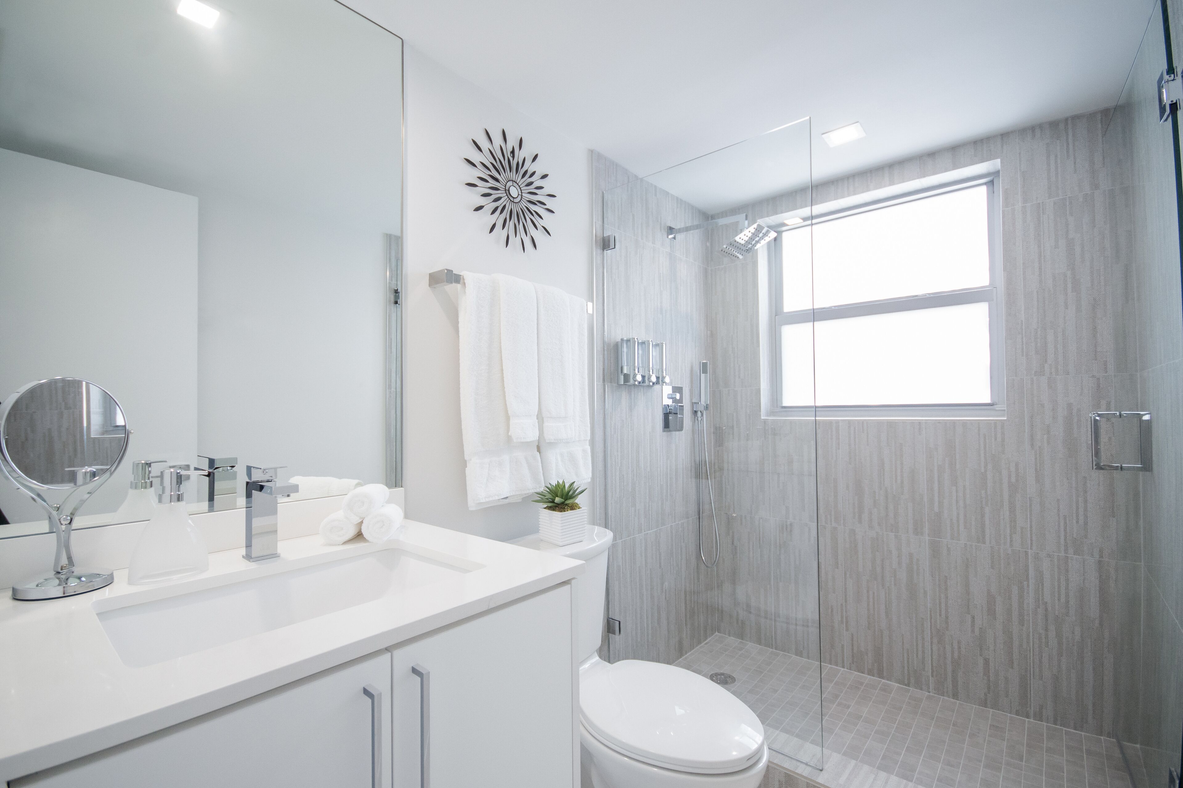 Shower, rainfall showerhead, hair dryer, towels