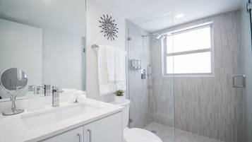 Shower, rainfall showerhead, hair dryer, towels