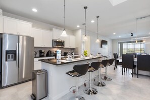 Villa | Private kitchen | Fridge, microwave, dishwasher, cookware/dishes/utensils