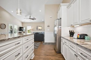 Dishwasher, coffee/tea maker, highchair, cookware/dishes/utensils