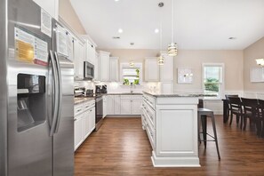 Dishwasher, coffee/tea maker, highchair, cookware/dishes/utensils