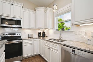 Dishwasher, coffee/tea maker, highchair, cookware/dishes/utensils