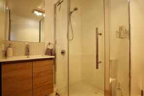 Bathtub, hair dryer, towels, soap