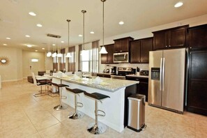 Villa | Private kitchen | Fridge, microwave, cookware/dishes/utensils