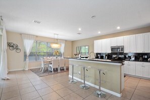 Fridge, microwave, cookware/dishes/utensils