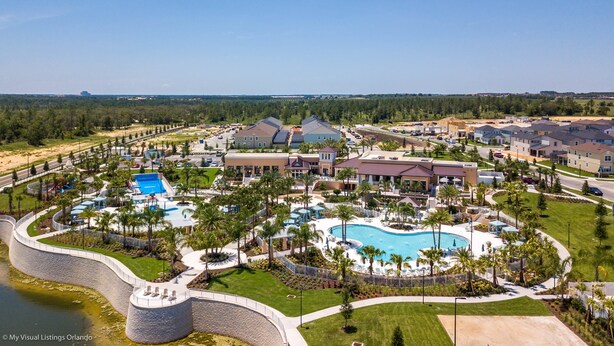 A resort with multiple swimming pools, a large central pool, and a water park area. - Amazing 6 Bedroom 5 Bathroom Solara Resort Villa (Kissimmee)