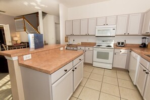 Villa | Private kitchen | Fridge, microwave, cookware/dishes/utensils