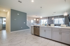 Villa | Private kitchen | Fridge, microwave, cookware/dishes/utensils