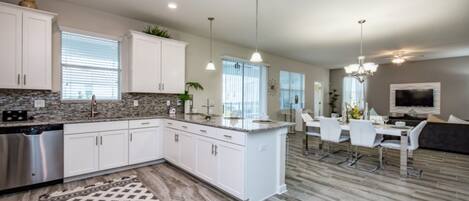 Villa | Private kitchen | Fridge, microwave, cookware/dishes/utensils