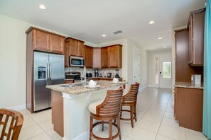 Villa (620LASS0) | Private kitchen | Fridge, microwave, highchair, cookware/dishes/utensils - Family Friendly 8 Bed Villa with Pool & Spa (Kissimmee)
