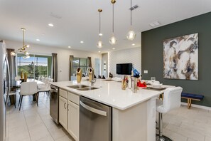 Villa | Private kitchen | Fridge, microwave, cookware/dishes/utensils