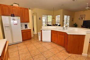 Villa | Private kitchen | Fridge, microwave, cookware/dishes/utensils