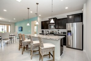 Villa | Private kitchen | Fridge, microwave, highchair, cookware/dishes/utensils