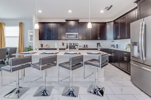 Villa | Private kitchen | Fridge, microwave, cookware/dishes/utensils