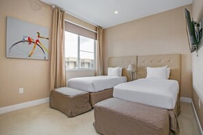A hotel room with two beds, a large window, a painting, and a flat-screen TV mounted on the wall. - 7577brooklin (Kissimmee)