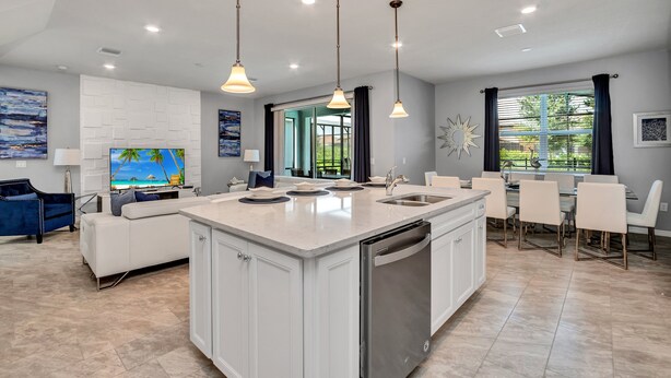 A modern kitchen with a central island, white cabinetry, and pendant lighting. - 5bed 4.5ba Villa Games Pool (Davenport)