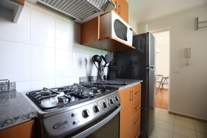 Apartment | Private kitchen | Fridge, microwave, oven, stovetop