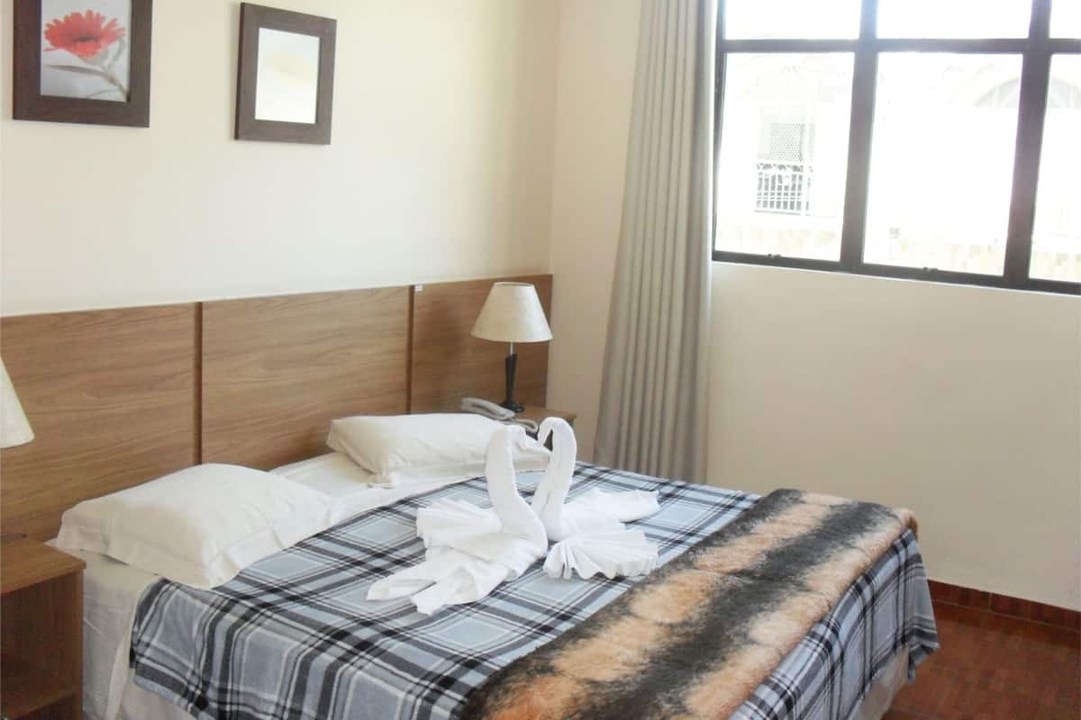 Minibar, desk, bed sheets