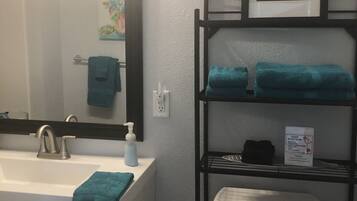 Shower, hair dryer, towels, soap