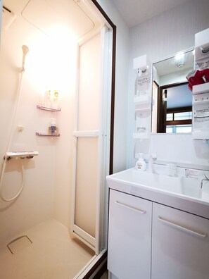 Room (2888) | Bathroom | Shower, free toiletries, hair dryer, slippers