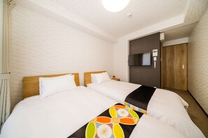 Economy Twin kamer | Een kluis op de kamer, verduisterende gordijnen, gratis wifi