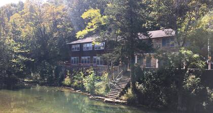 Historic Limestone House in park setting in Ozarks