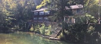 Historic Limestone House in park setting in Ozarks