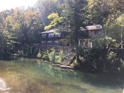 Historic Limestone House in park setting in Ozarks