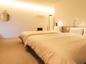 デラックス トリプルルーム 禁煙 | 高級寝具、羽毛の掛け布団、遮光カーテン、WiFi (無料)