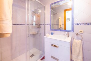 Bathtub, hair dryer, towels