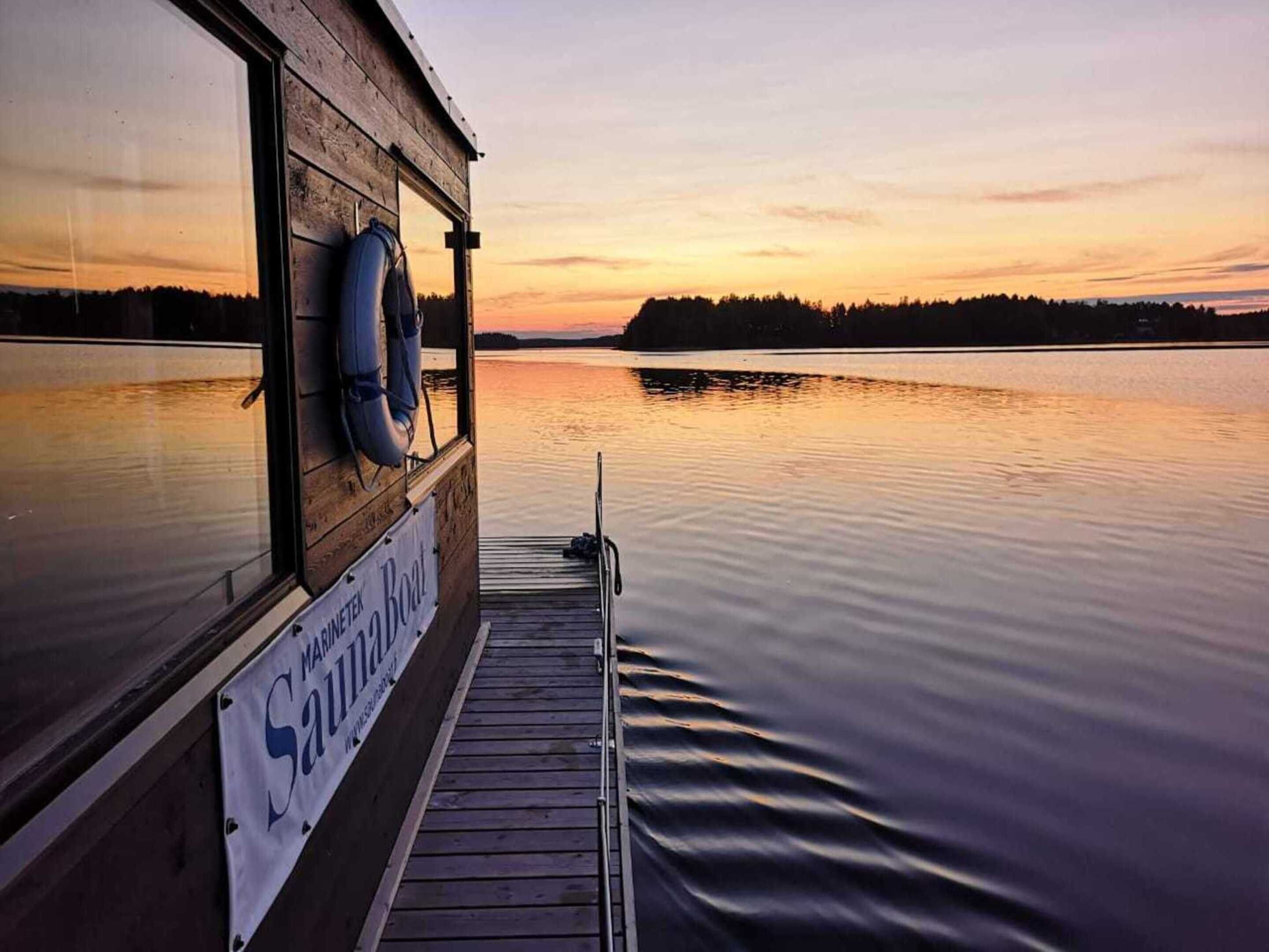 A boat with a lifebuoy and a sign reading "SAUNTERING BOAT."