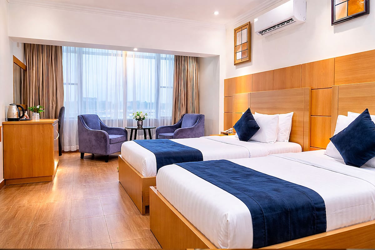 Habitación Deluxe con 2 camas individuales | Sábanas de algodón egipcio, ropa de cama de alta calidad y edredón