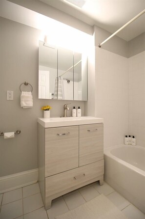 Shower, hair dryer, towels, shampoo