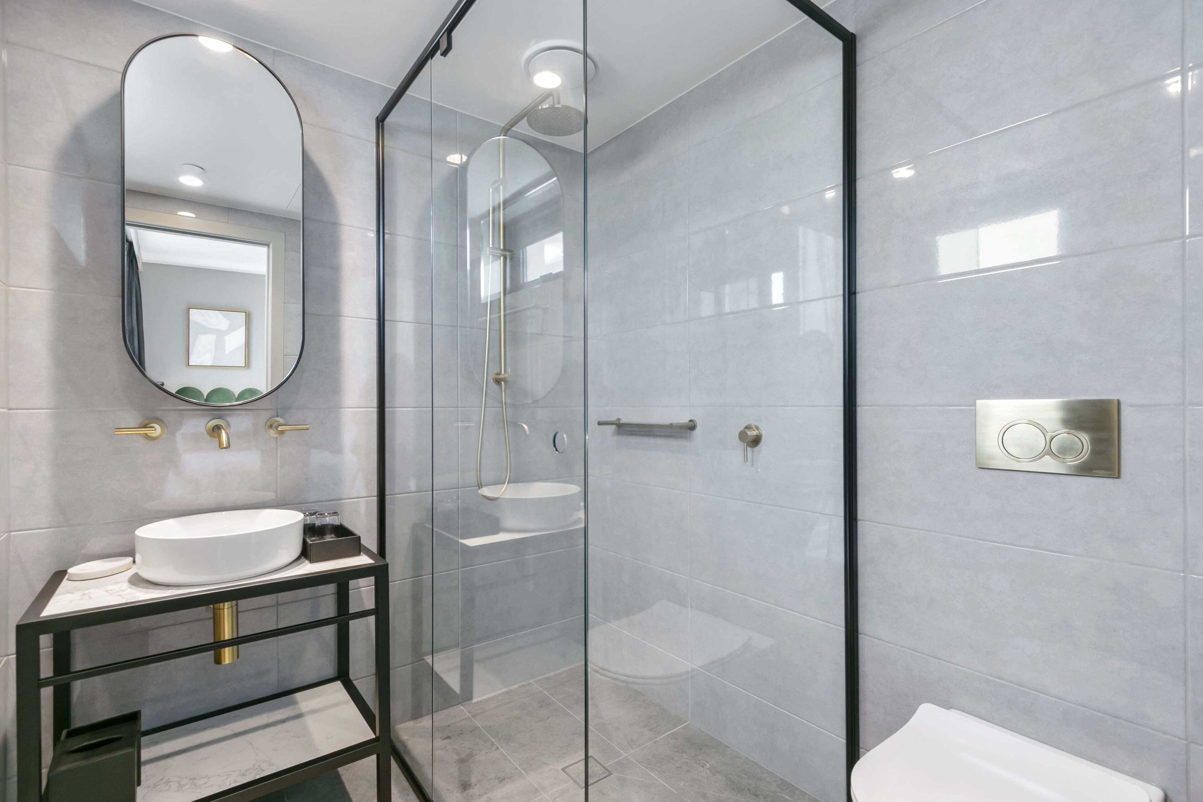 two bedroom king apartment | bathroom | shower, free toiletries, hair dryer, towels